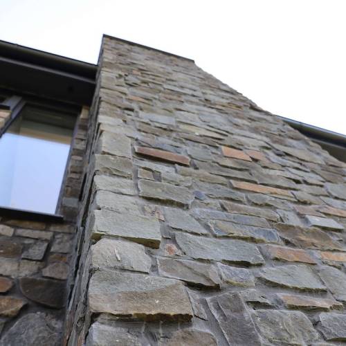Blue stone cladding chimney stack